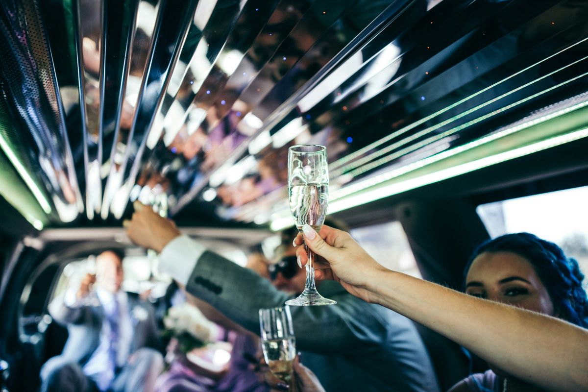 Friends toasting on a limo